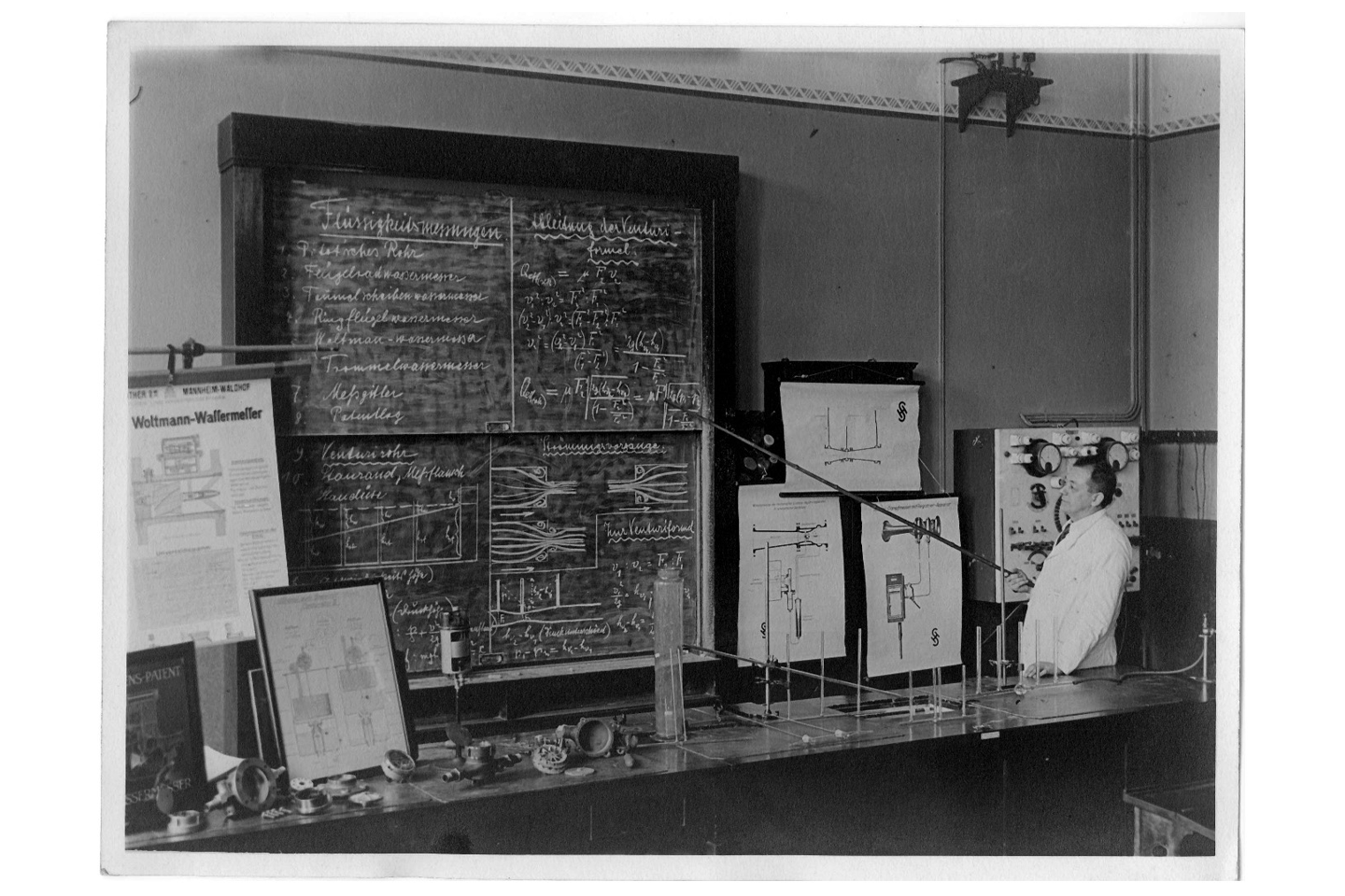 black and white photo of blackboard and lecturers