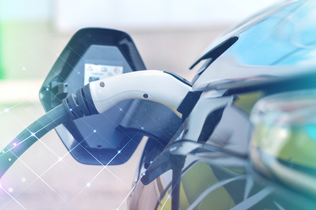 Close-up of an electric car and its charging cable / Link leads to the project website